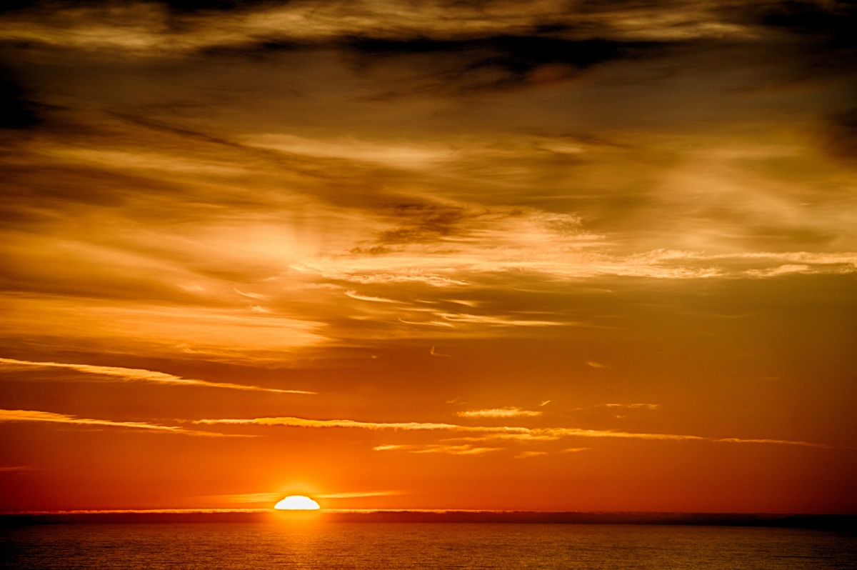 vibrant orange sunset over the ocean